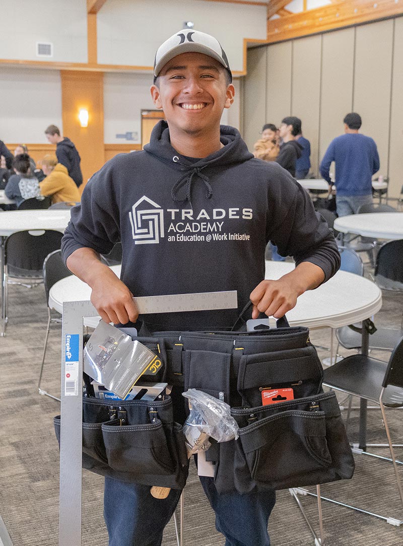 A TASI participant shows off his project