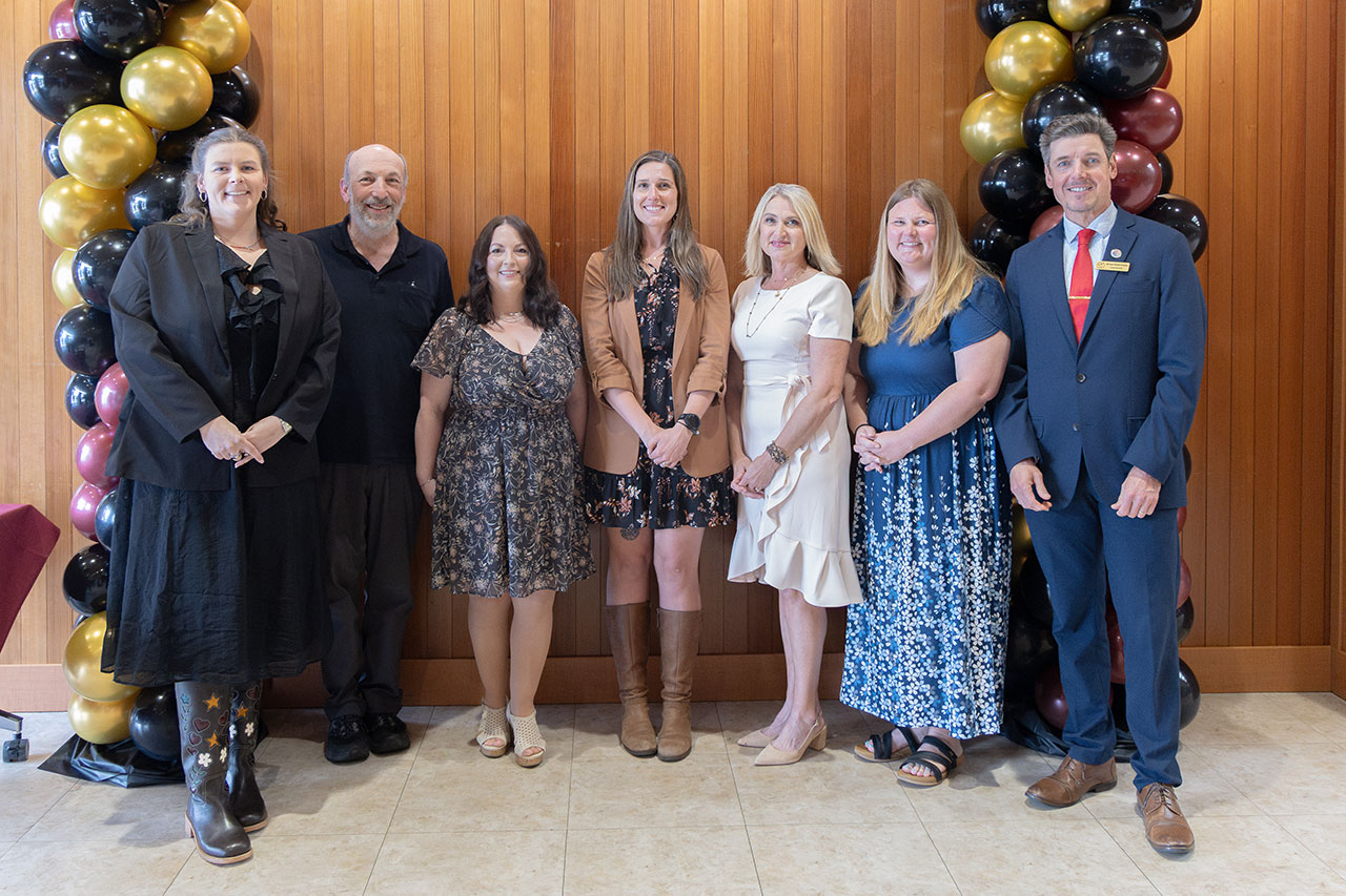Left to right: Rachel Whitaker, Bernie Levy (Jean Olson Award recipient), Jennifer Harvey, Hope von Werlhof, Amber Coley, Crystal Fennell, Superintendent of Schools Michael Davies-Hughes