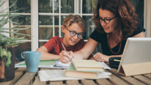 Parent and child studying at home