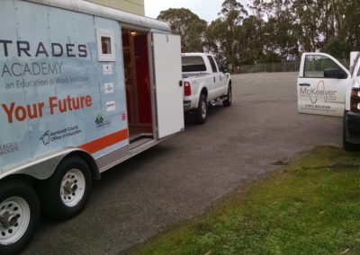 Mobile Trades lab and McKeever electric truck outside