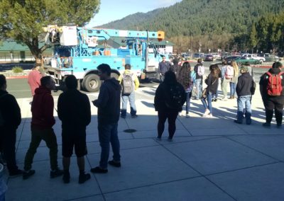 Students gather in front of hoopa valley high school to look at the PG&E truck