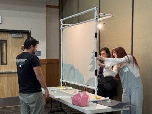 Photo of educators practicing puppet show performances