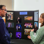Grace Humphries talks with Deputy Superintendent Dr. Colby Smart.