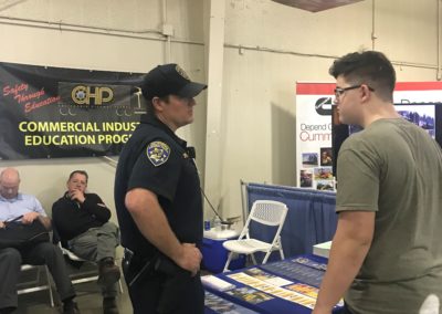 A student talks to a CHP officer