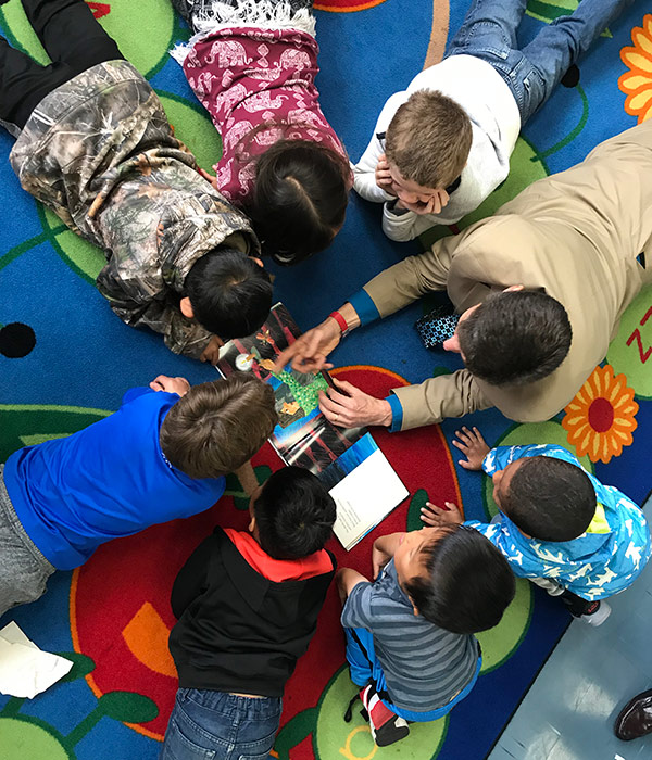 Michael Davies-Hughes with a group of kids