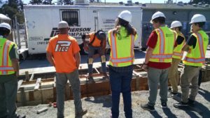 Students watch Pierson Company construction worker