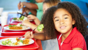 Student eating in school cafeteria