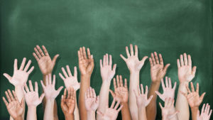 Students' hands in the air