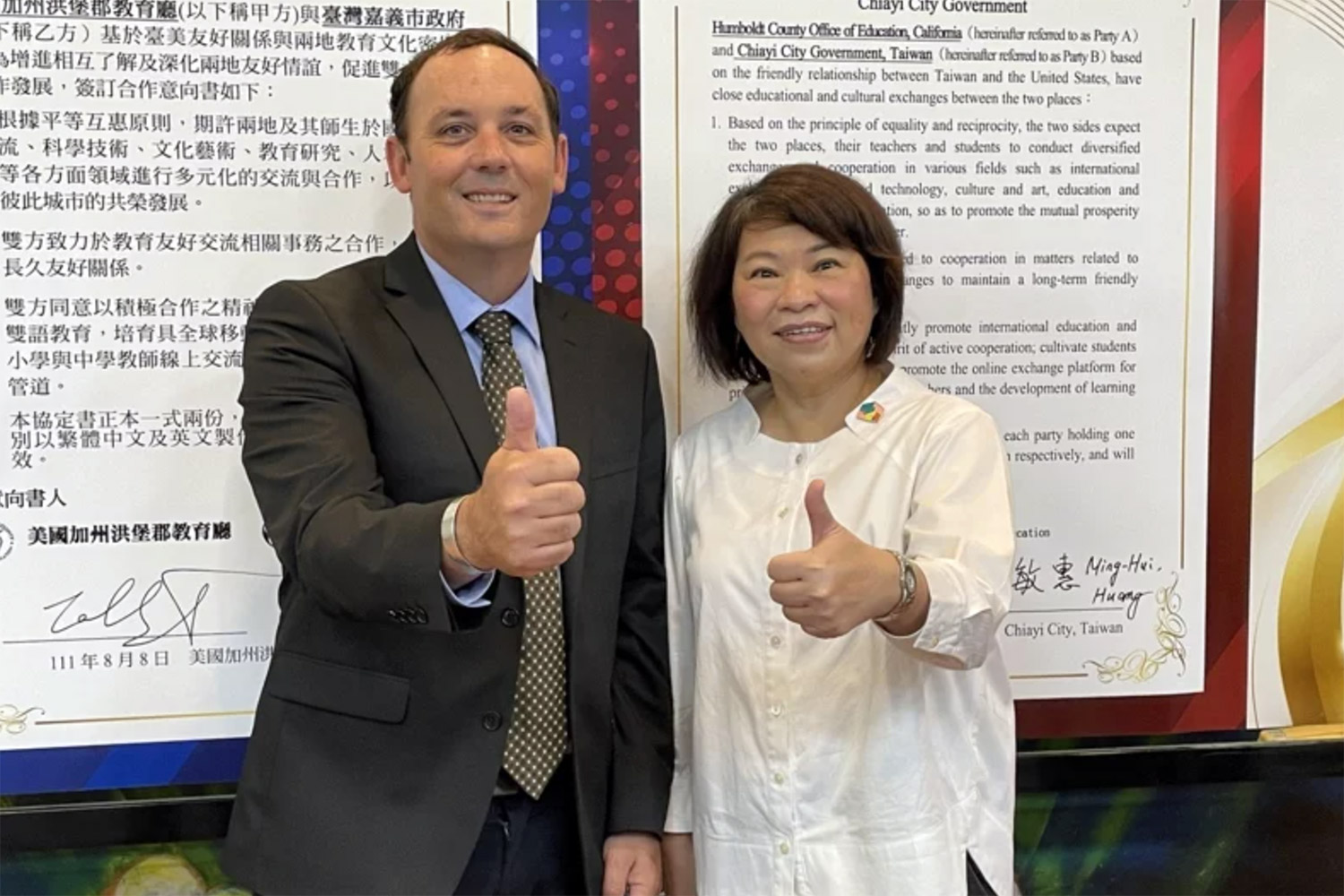 HCOE Assistant Superintendent Colby Smart with a Taiwanese educator