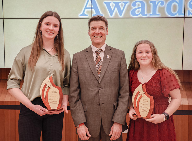 The 2024 stellar students, Madelyn Shanahan on the left, and Elizabeth Mengel on the right, with Superintendent Michael Davies-Hughes