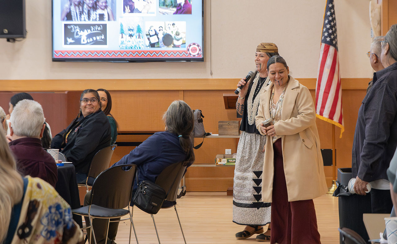 Attendees of the NASMC Celebration chat during a seminar.