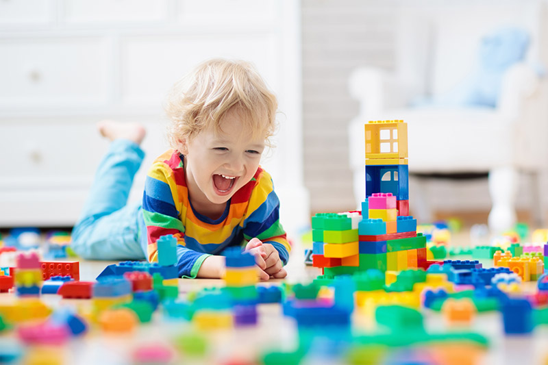 A young child playing with blocks